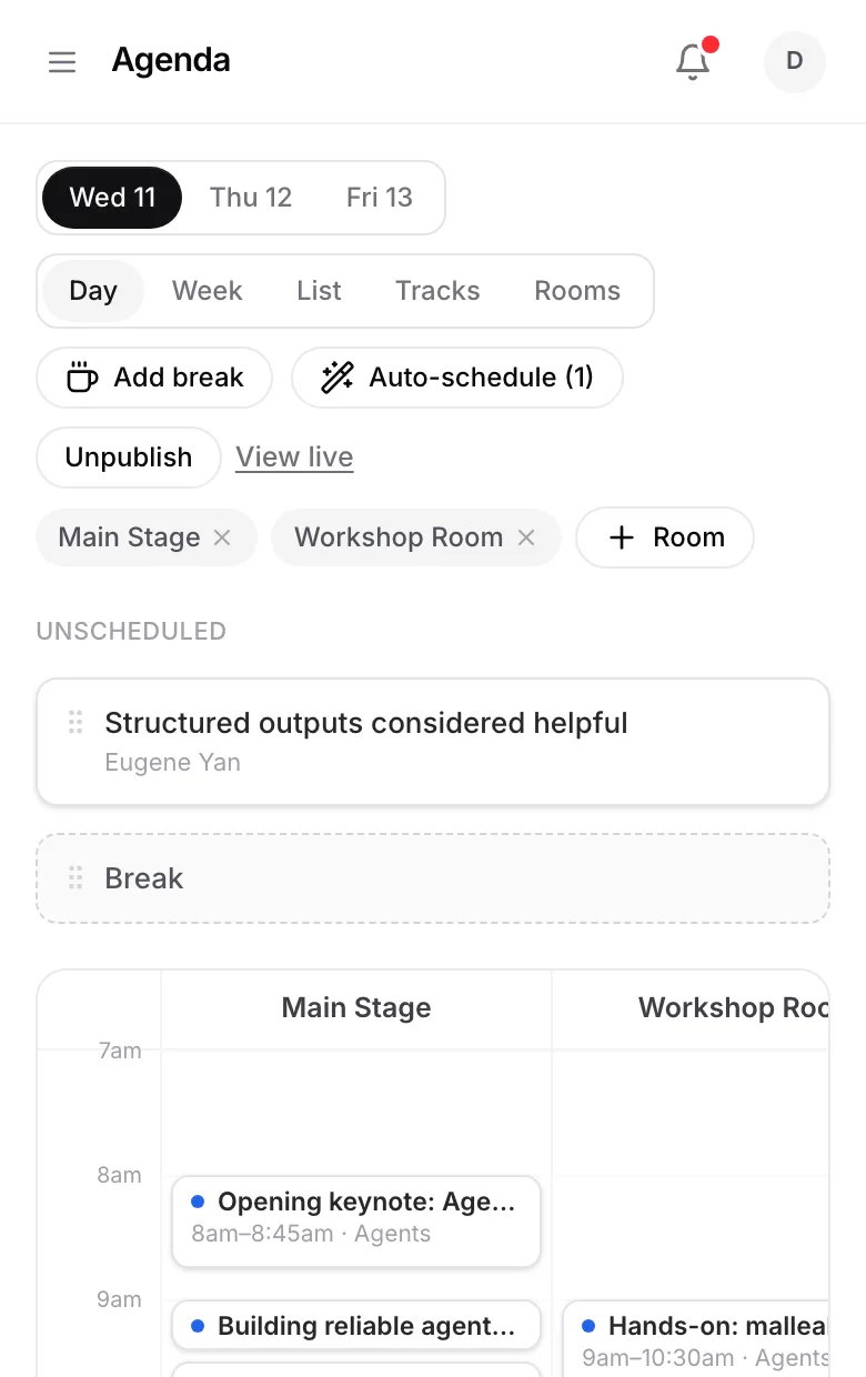 The agenda builder: a day-by-room grid with talks placed in time slots and an unscheduled queue beside it.