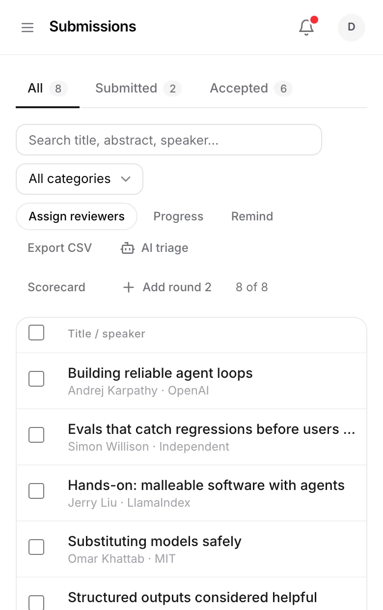 The submissions table with speakers, tracks, review scores, and accept or reject status.